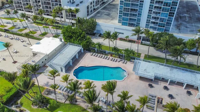 a view of a backyard with plants and outdoor seating