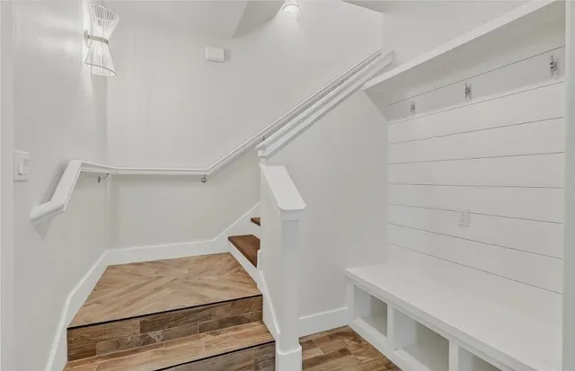 a view of a kitchen with refrigerator and window
