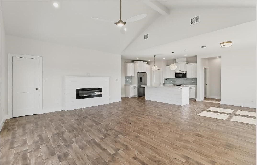 15206 Cruiser Street Corpus Christi, TX 78418 - Photo 6 of 10 a view of a kitchen with a sink and a stove top oven