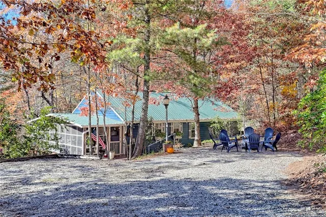 a view of street with lots of trees and plants