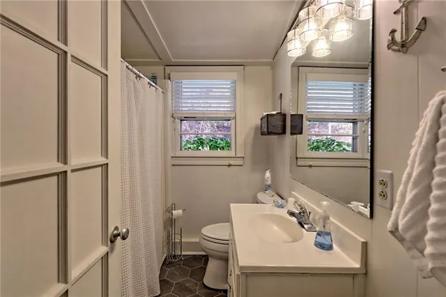 a view of a hallway with wooden floor and entryway