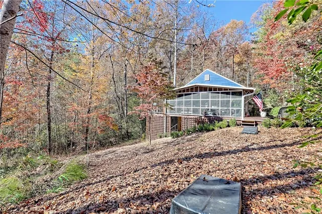a view of a chairs and table in the balcony