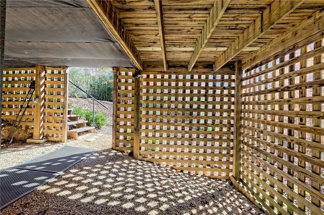 an aerial view of a house with a garden and swimming pool