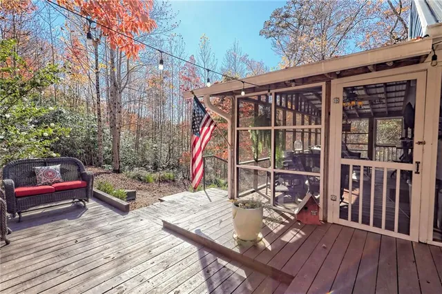 a view of a wooden deck with a backyard