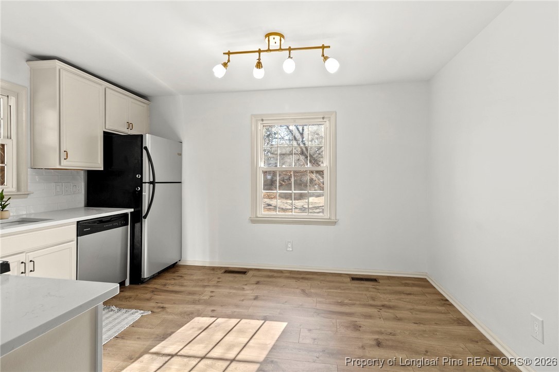 5434 Hampton Road Fayetteville, NC 28311 - Photo 19 of 45 a kitchen with a refrigerator and a stove top oven