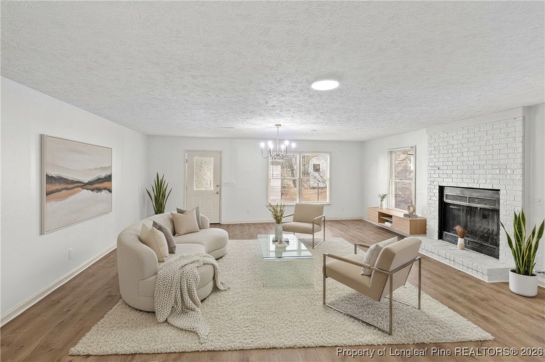 5434 Hampton Road Fayetteville, NC 28311 - Photo 22 of 45 a living room with furniture and a fireplace