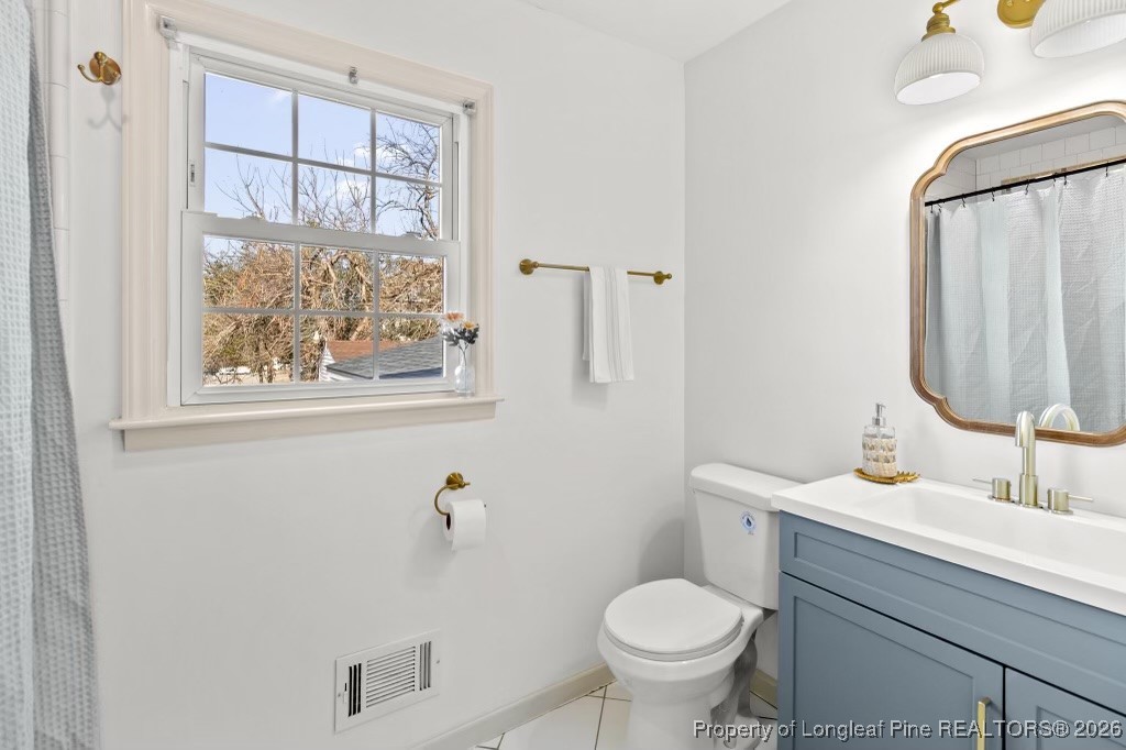 5434 Hampton Road Fayetteville, NC 28311 - Photo 29 of 45 a bathroom with a sink toilet and mirror