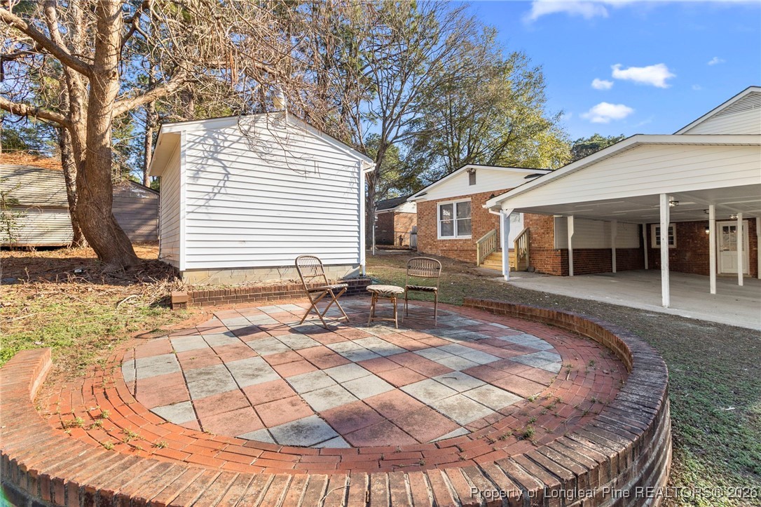 5434 Hampton Road Fayetteville, NC 28311 - Photo 40 of 45 a view of a house with backyard and sitting area