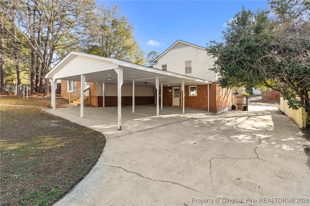 5434 Hampton Road Fayetteville, NC 28311 - Photo 41 of 45 a view of a house with a yard covered in snow