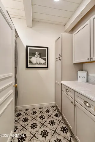 a room with a stove and a painting on the wall