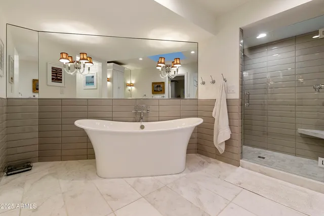 a bathroom with a bathtub and shower