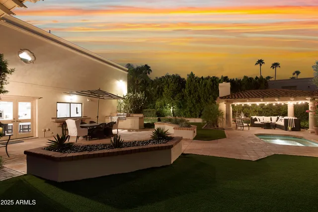 a living room with couches and a view of the ocean