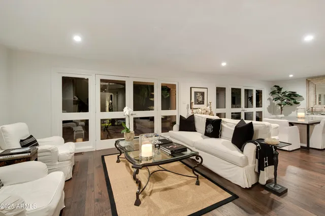 a living room with furniture and a table