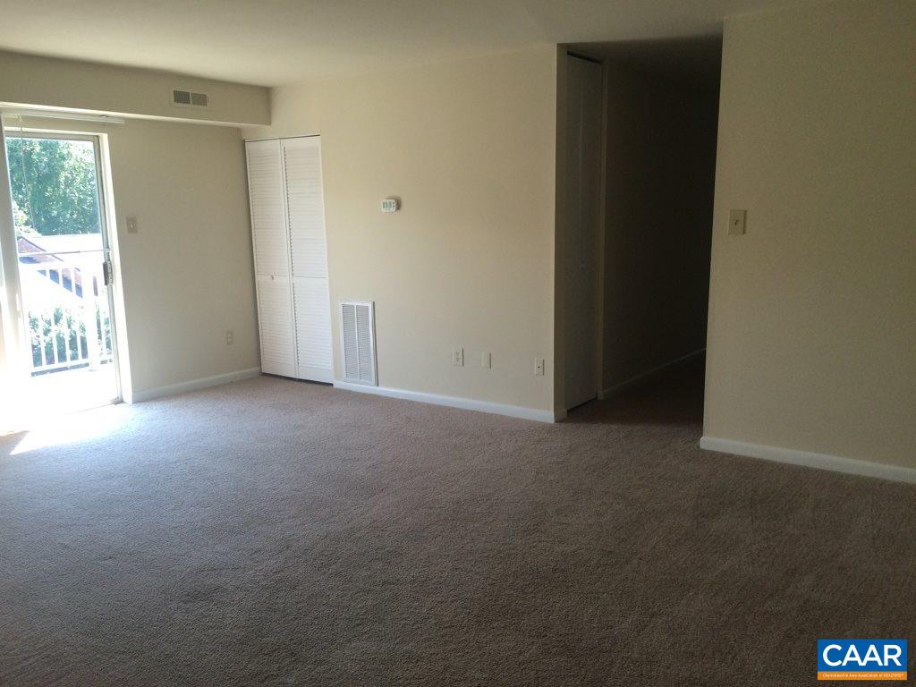 2691 Barracks Road, Unit 10 Charlottesville, VA 22901 - Photo 2 of 10 an empty room with windows