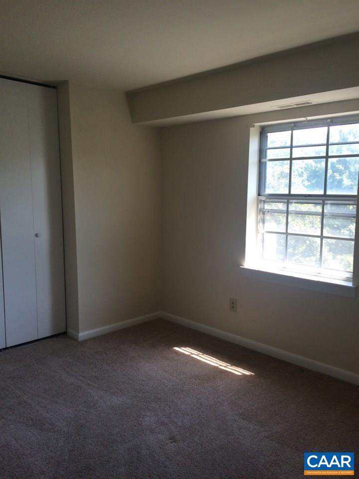 2691 Barracks Road, Unit 10 Charlottesville, VA 22901 - Photo 4 of 10 an empty room with a window