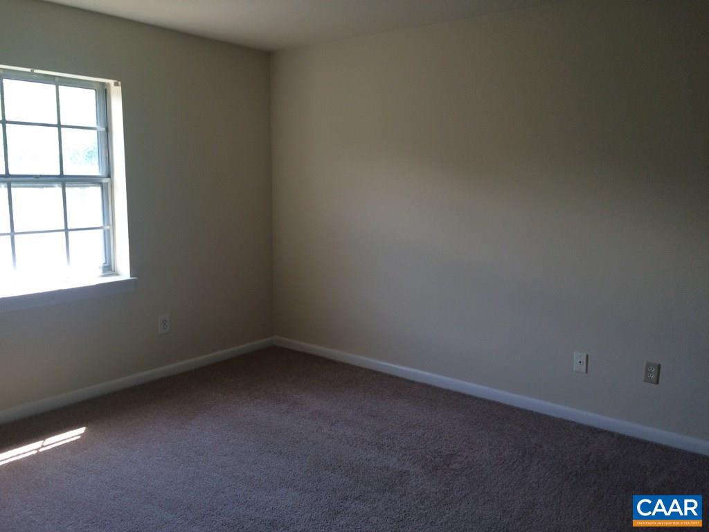 2691 Barracks Road, Unit 10 Charlottesville, VA 22901 - Photo 5 of 10 an empty room with a window