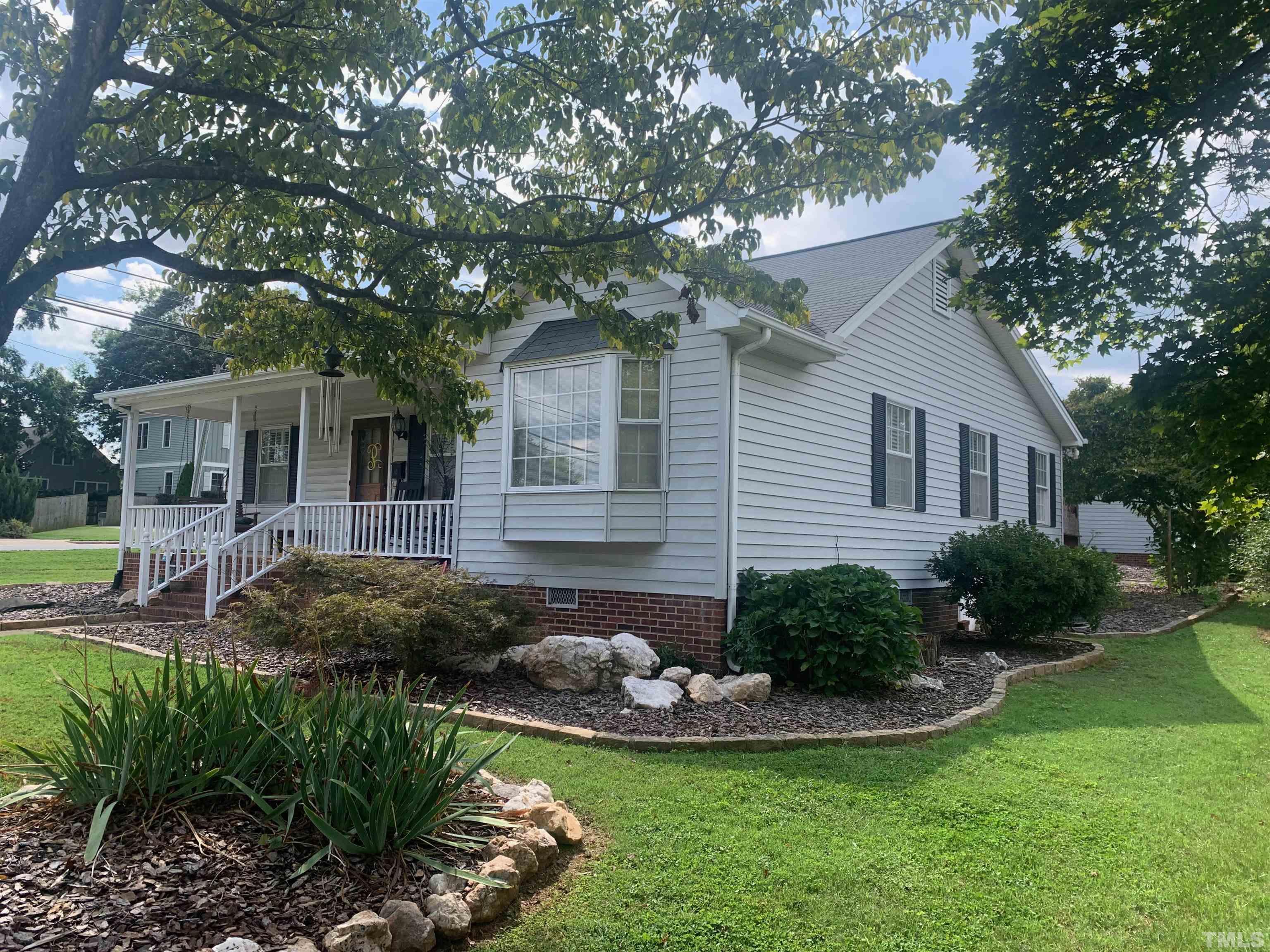 1801 Ridley Street Raleigh, NC 27608 - Photo 2 of 4 a view of a house with backyard and sitting area