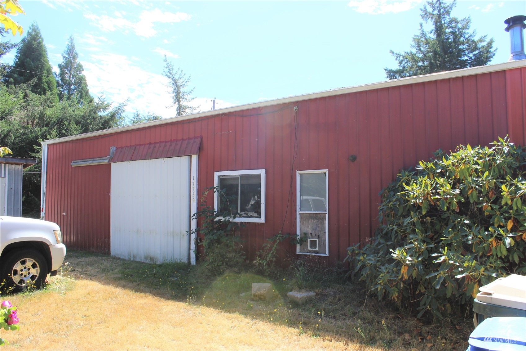 17739 Pendleton Street Southwest Rochester, WA 98579 - Photo 1 of 26 a backyard of a house with lots of green space
