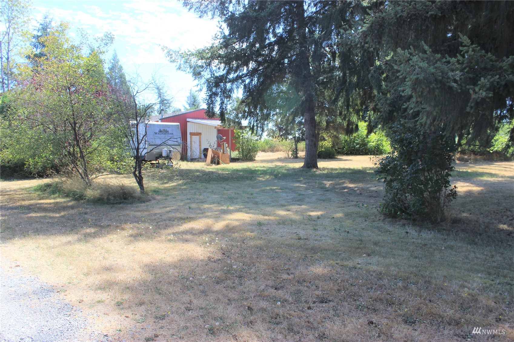 17739 Pendleton Street Southwest Rochester, WA 98579 - Photo 6 of 26 a view of a yard with a tree