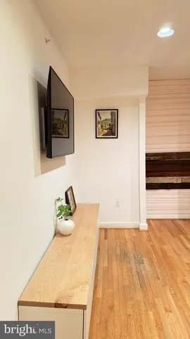 a room with a sink and a flat screen tv