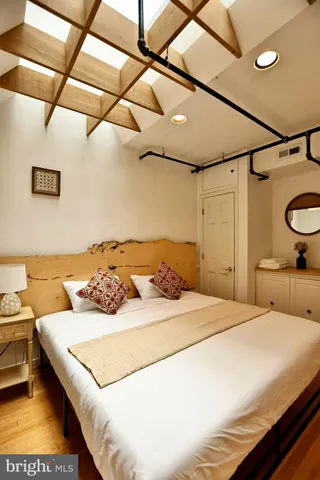 a bedroom with a bed and a couch