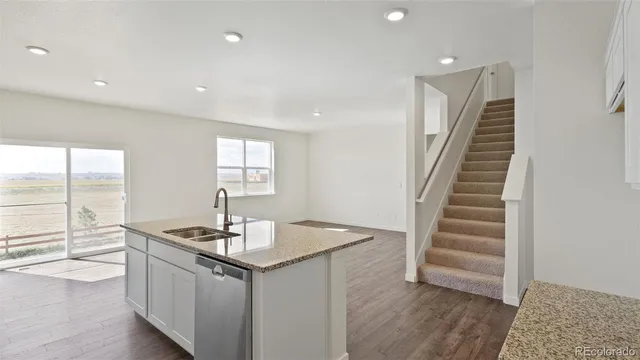 a kitchen with sink and window
