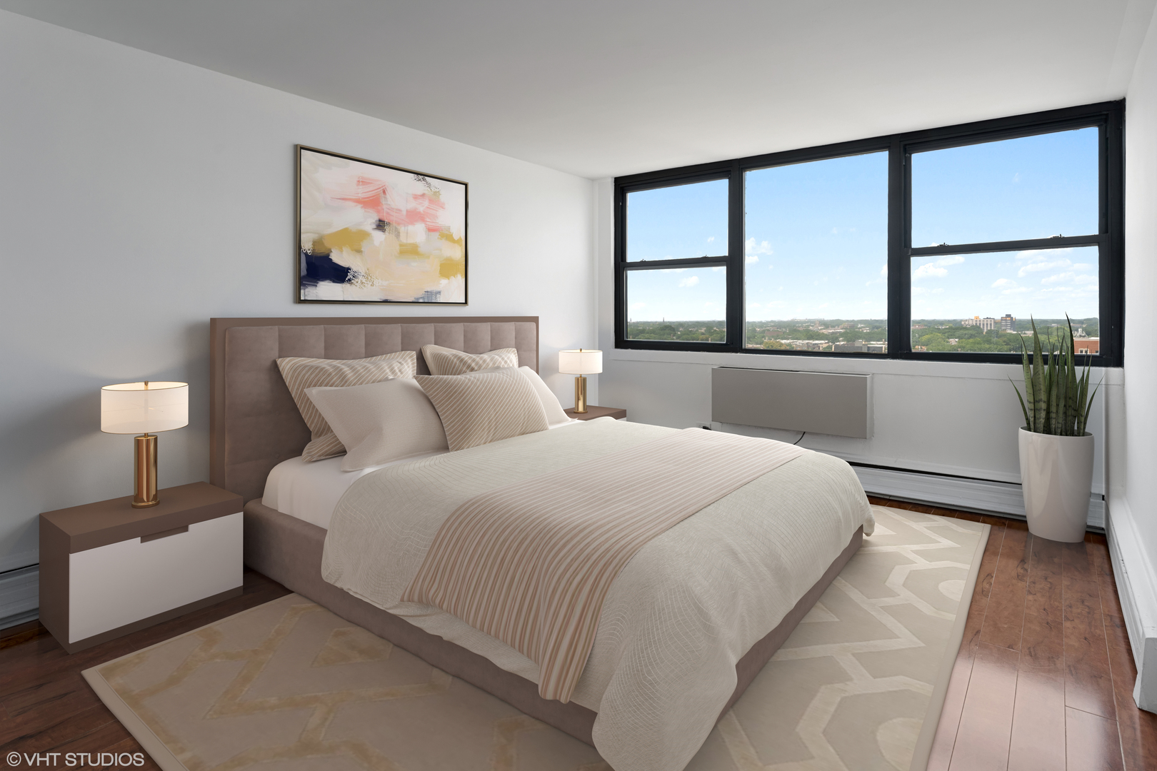 5740 North Sheridan Road, Unit 14C Chicago, IL 60660 - Photo 4 of 11 a bedroom with a large bed and a window