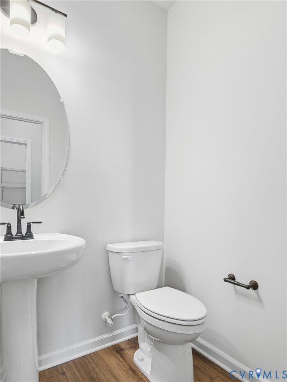 109 This Way Midlothian, VA 23114 - Photo 18 of 21 a bathroom with a toilet a sink and mirror