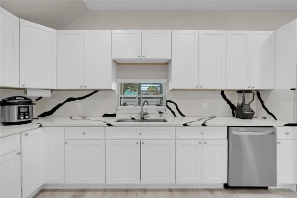 a bedroom with a bed and a tv