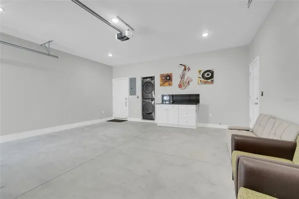 a view of a livingroom with furniture and a ceiling fan