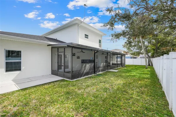a view of a house with backyard