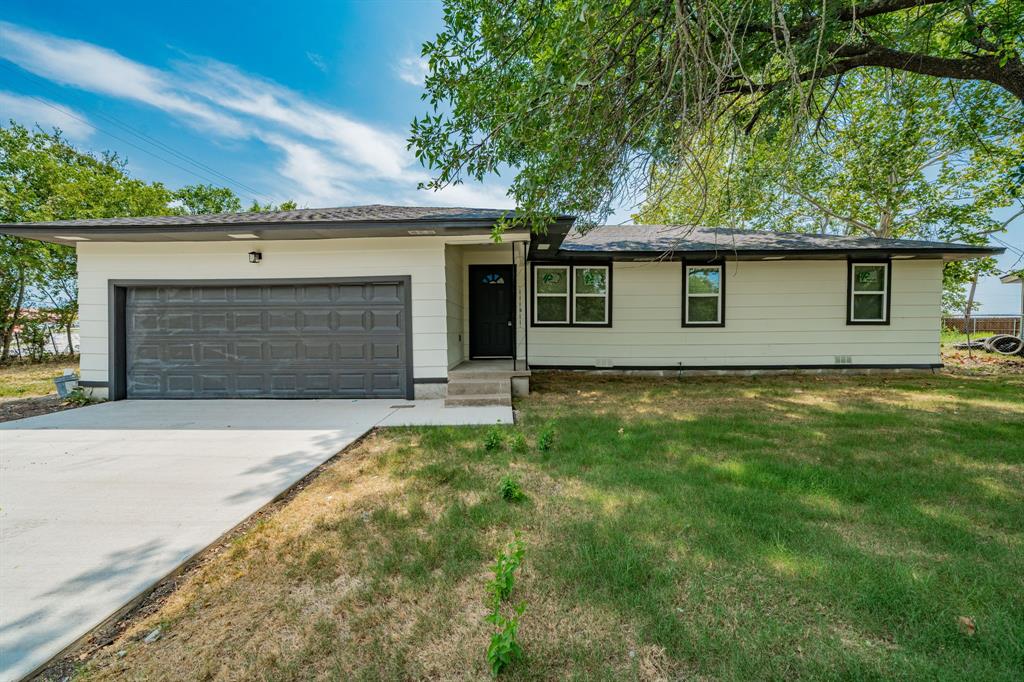 front view of house with a yard