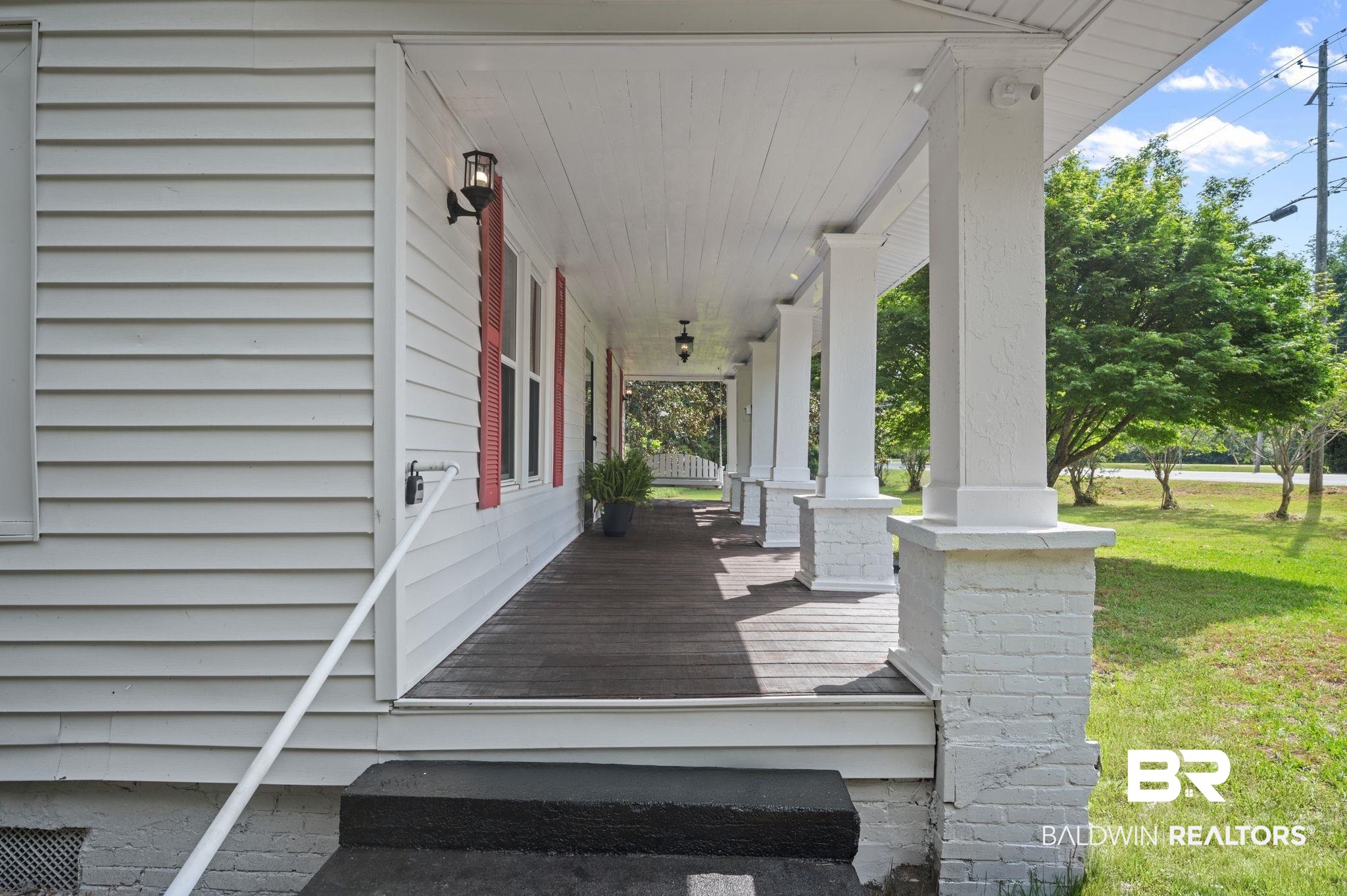 733 Pineville Road Monroeville, AL 36460 - Photo 49 of 68 Deck with covered porch and a yard