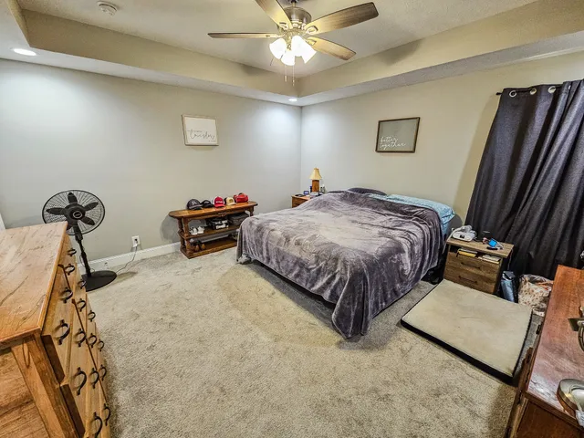 a bathroom with a granite countertop double vanity sink and a mirror