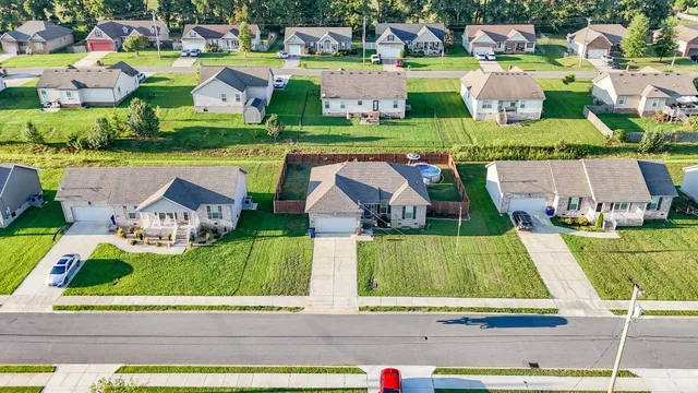 an aerial view of multiple houses with outdoor space