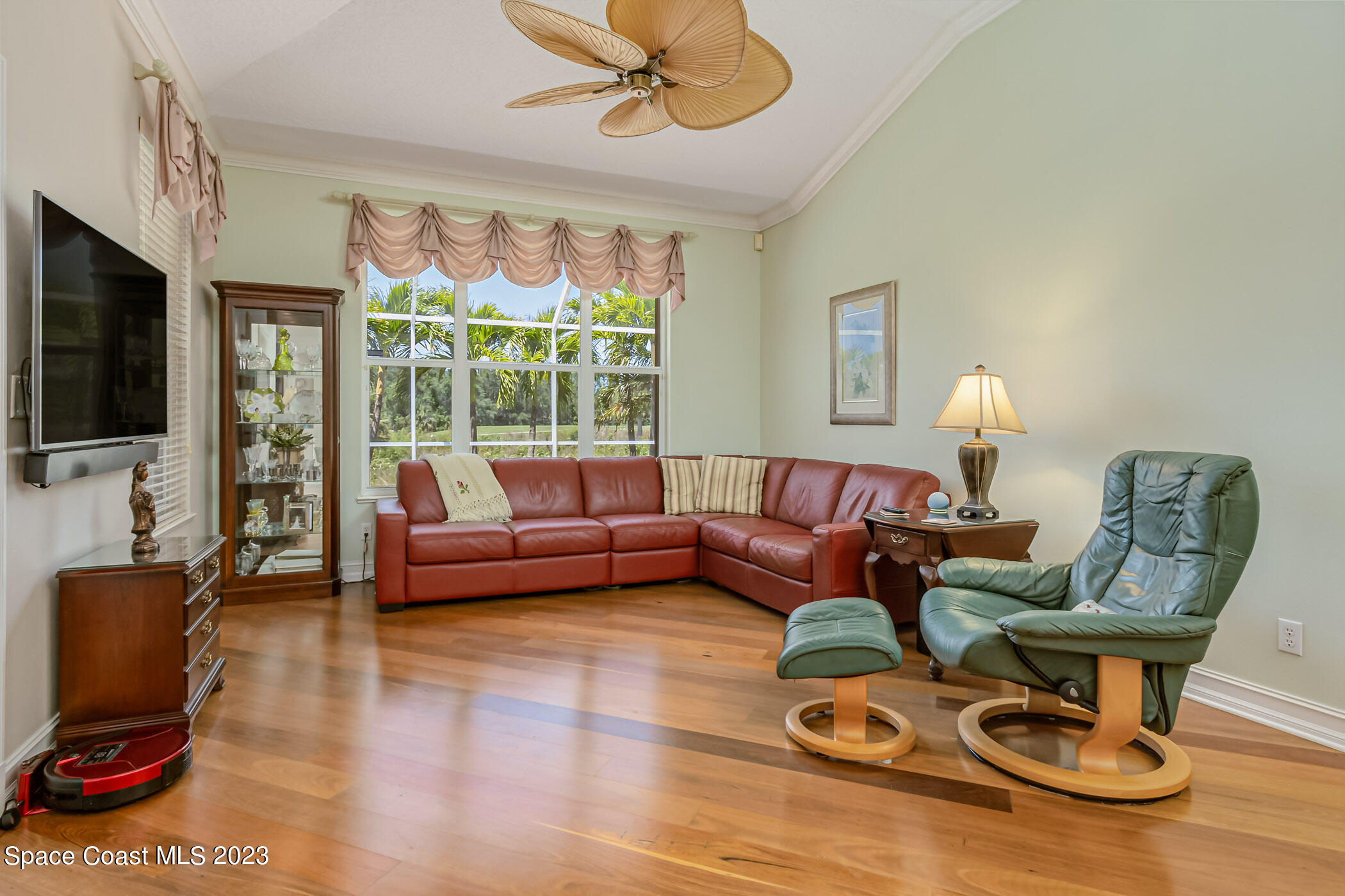 4481 Aberdeen Circle Rockledge, FL 32955 - Photo 15 of 70 a living room with furniture a flat screen tv and a large window