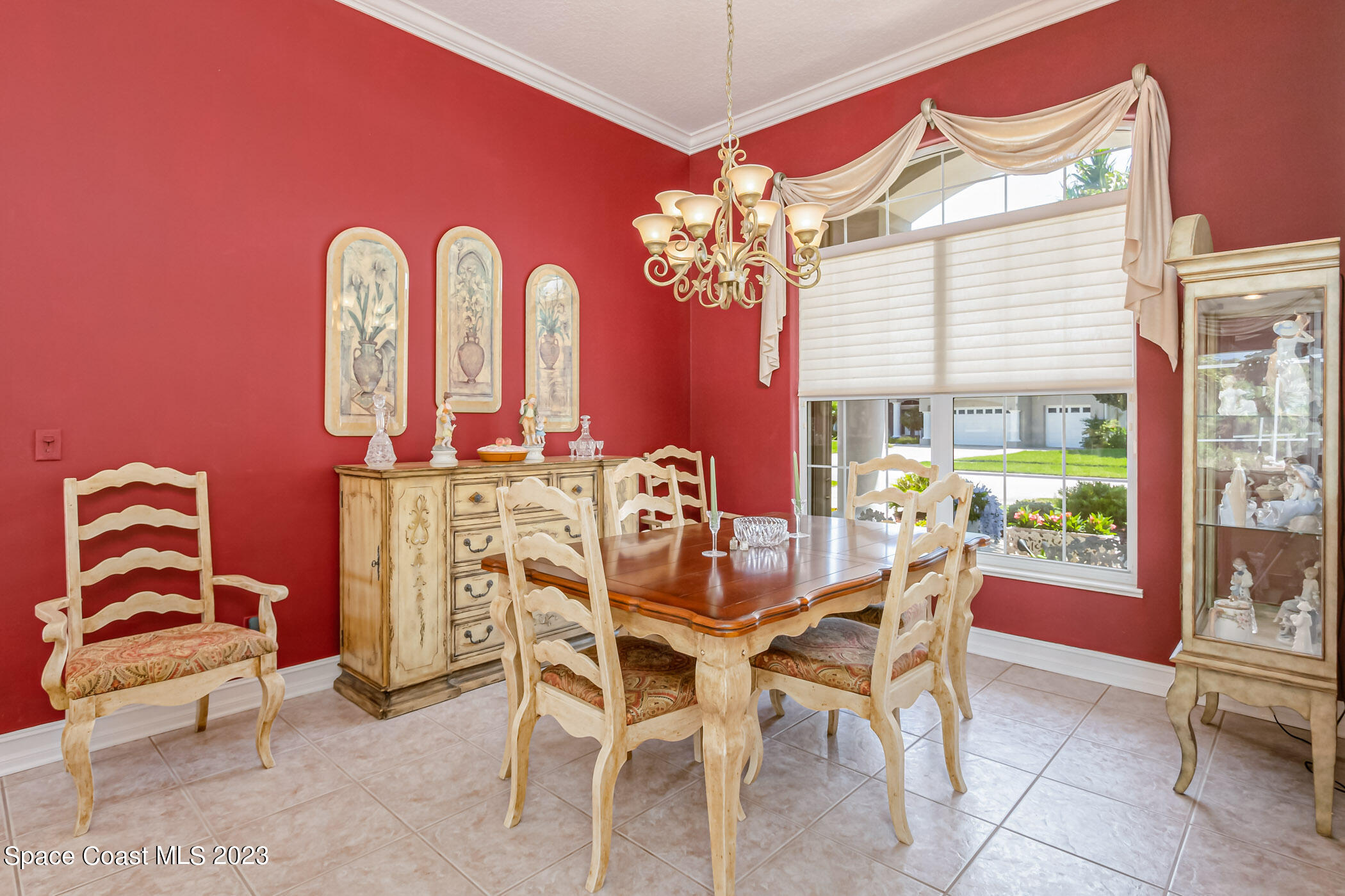 4481 Aberdeen Circle Rockledge, FL 32955 - Photo 22 of 70 a view of a dining room with furniture a chandelier and a window
