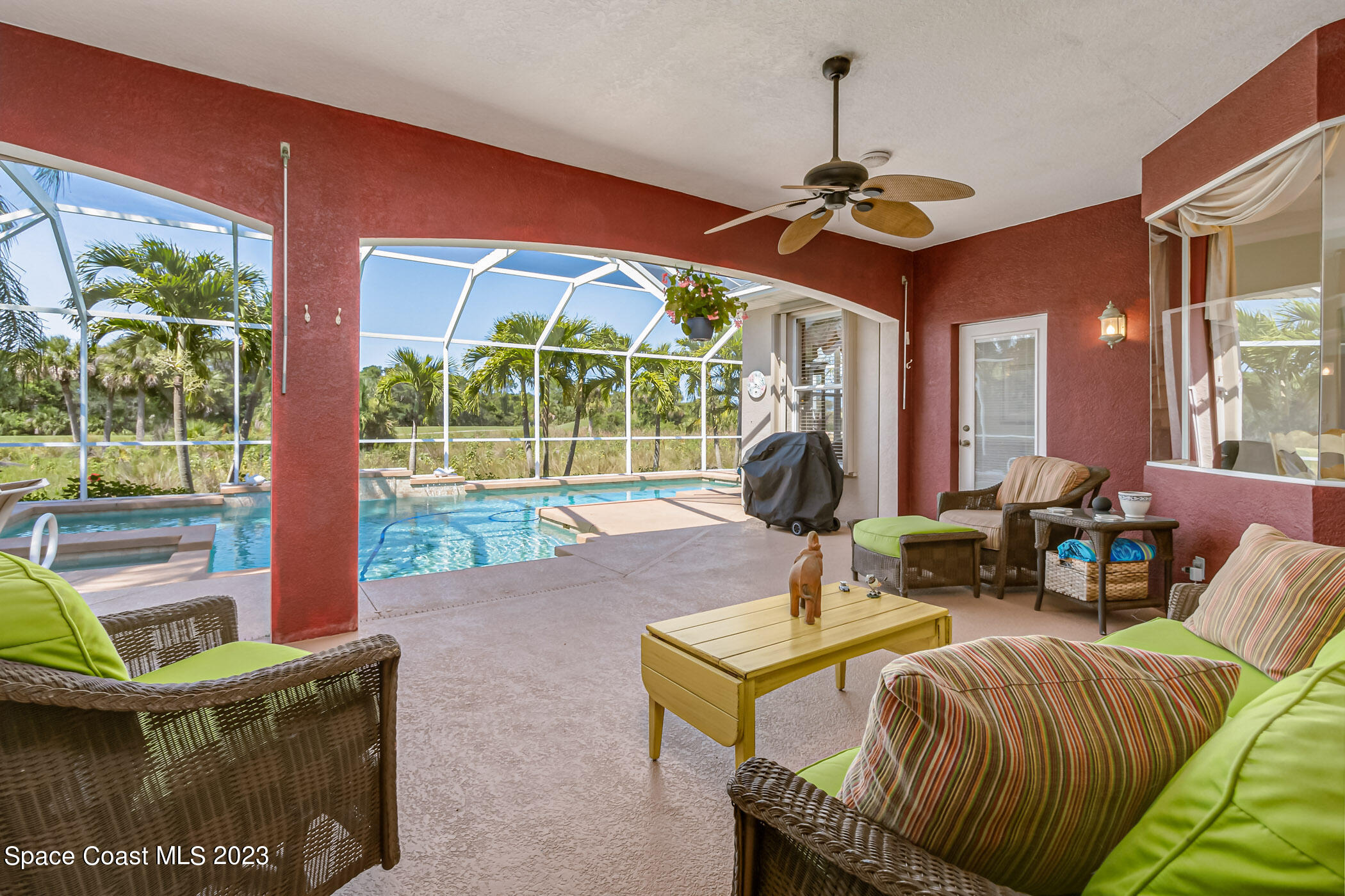 4481 Aberdeen Circle Rockledge, FL 32955 - Photo 34 of 70 a living room with fireplace furniture and a large window