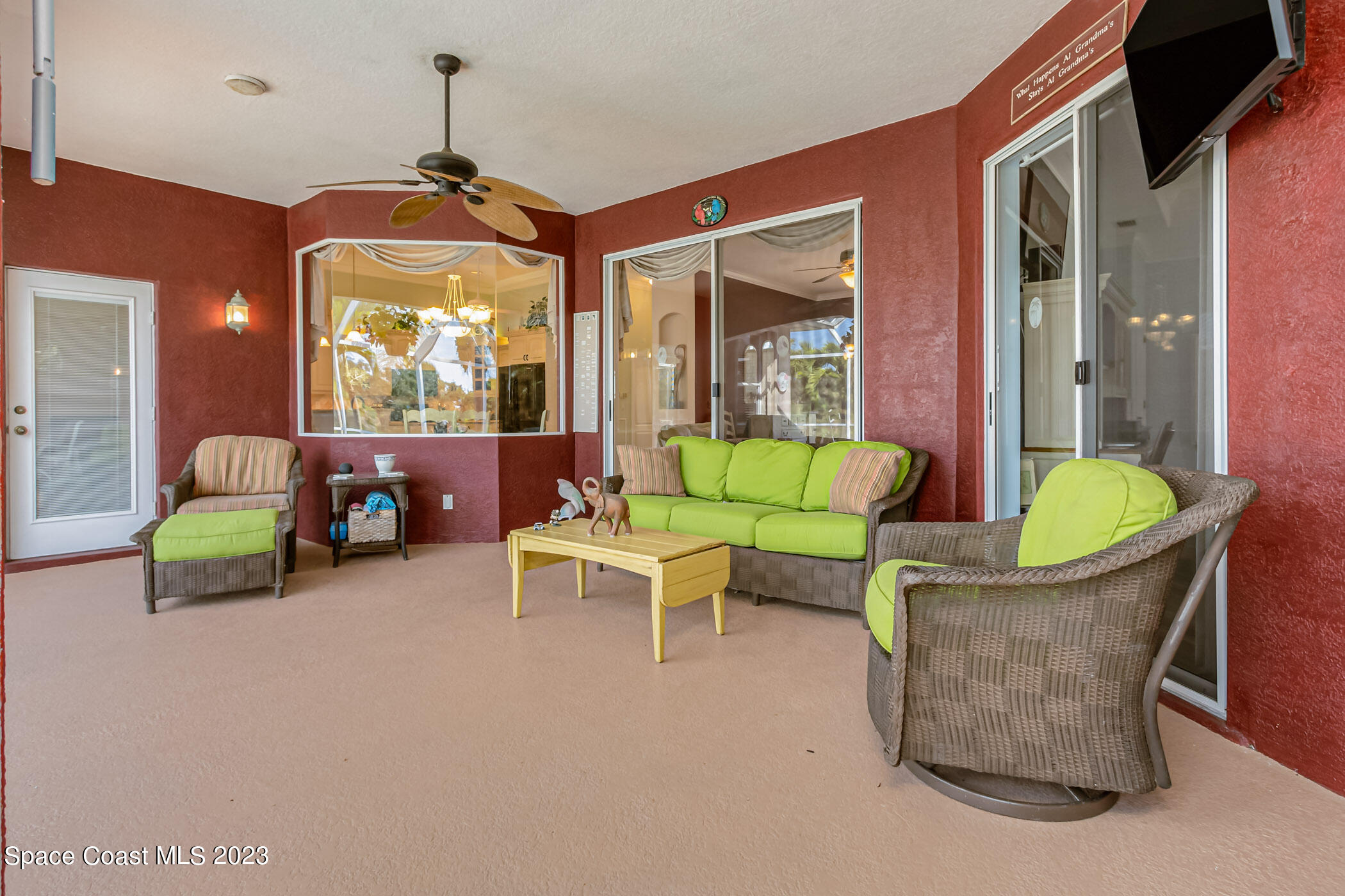 4481 Aberdeen Circle Rockledge, FL 32955 - Photo 36 of 70 a living room with furniture and a chandelier