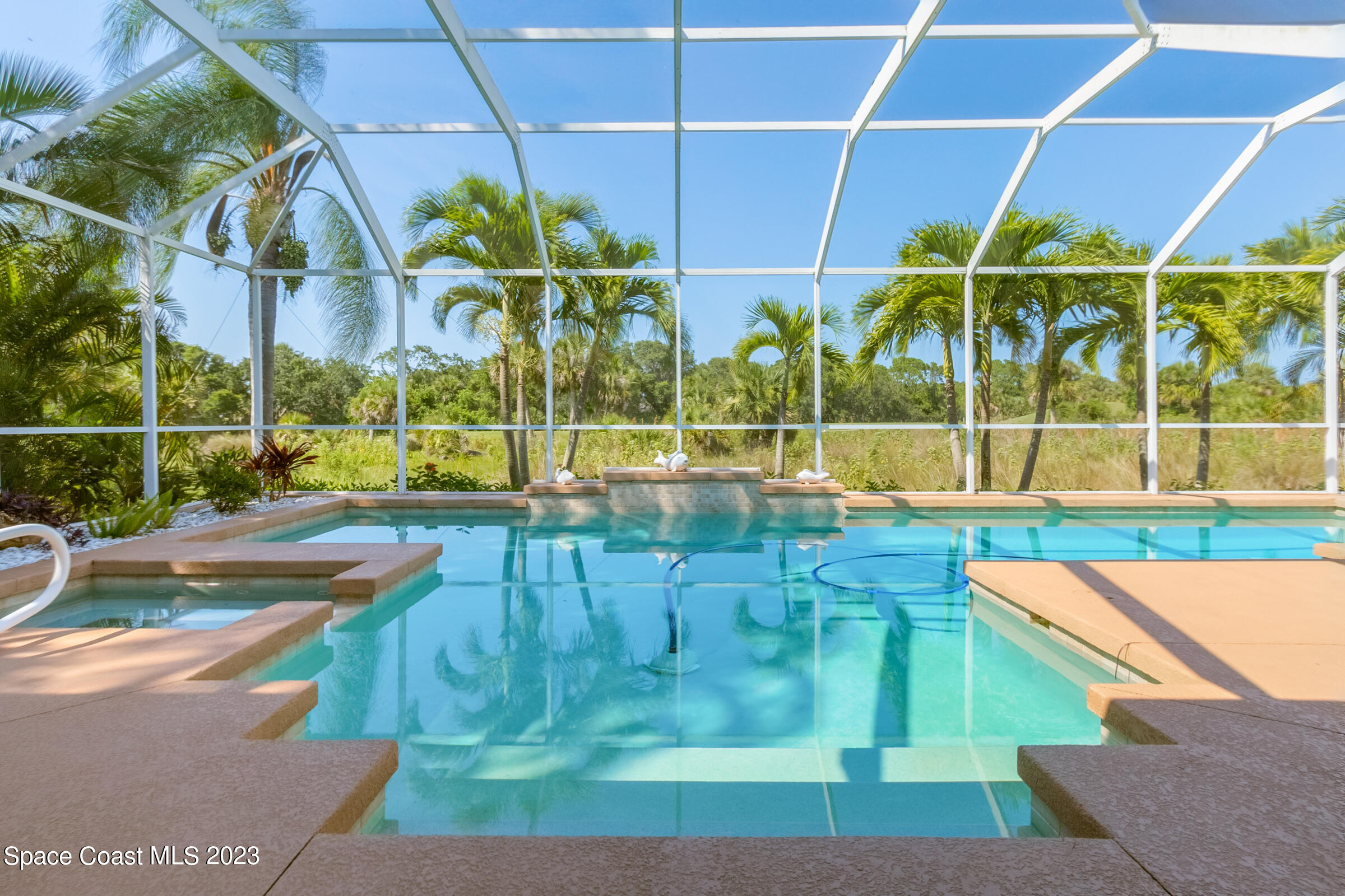 4481 Aberdeen Circle Rockledge, FL 32955 - Photo 4 of 70 a view of a swimming pool with a patio