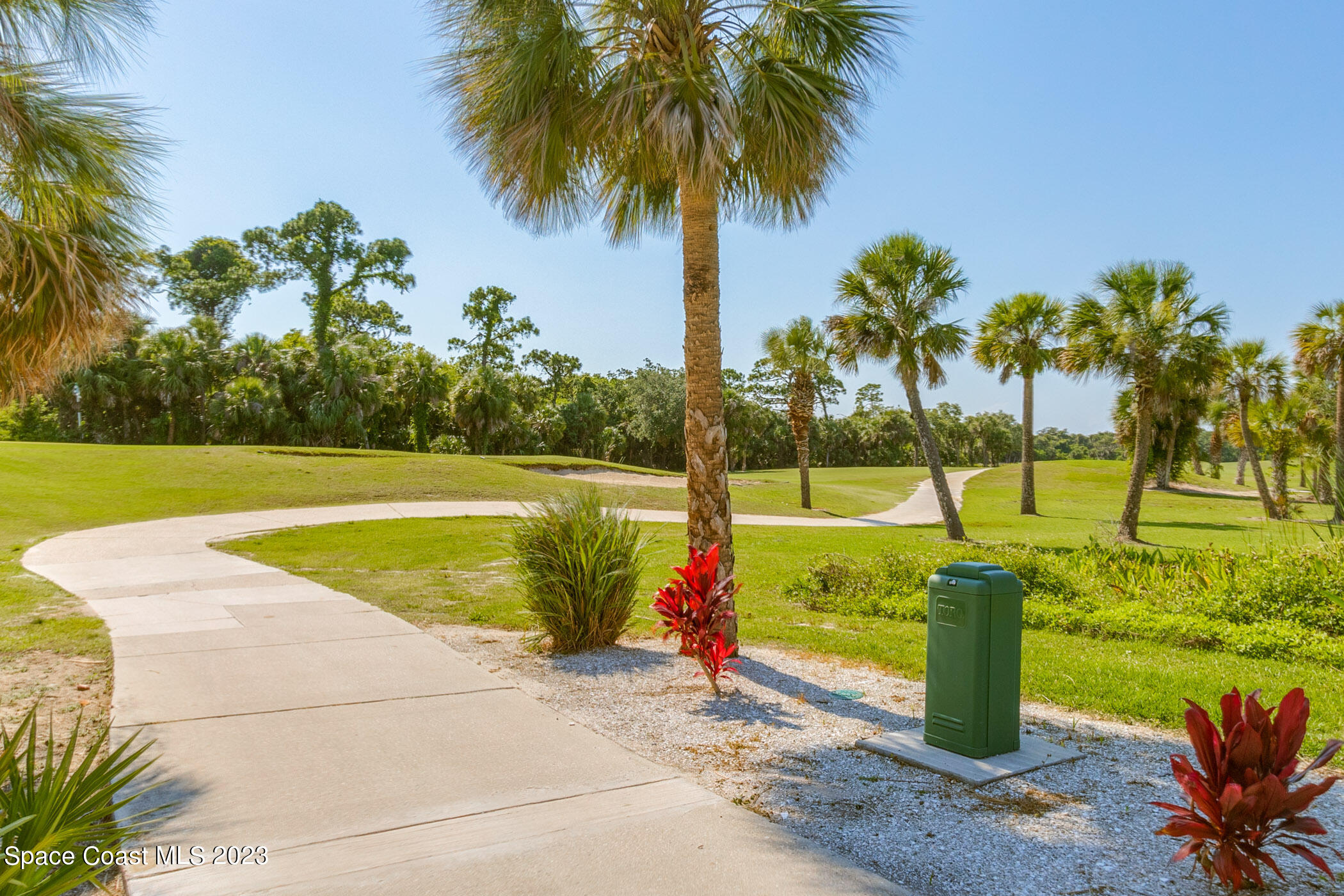 4481 Aberdeen Circle Rockledge, FL 32955 - Photo 43 of 70 a view of a swimming pool with a yard and palm trees