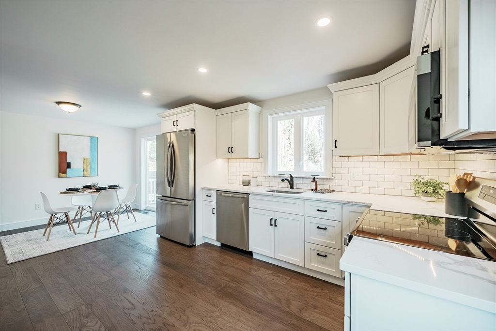 41 Leverett Road Amherst, MA 01002 - Photo 4 of 27 a kitchen with a refrigerator and a sink