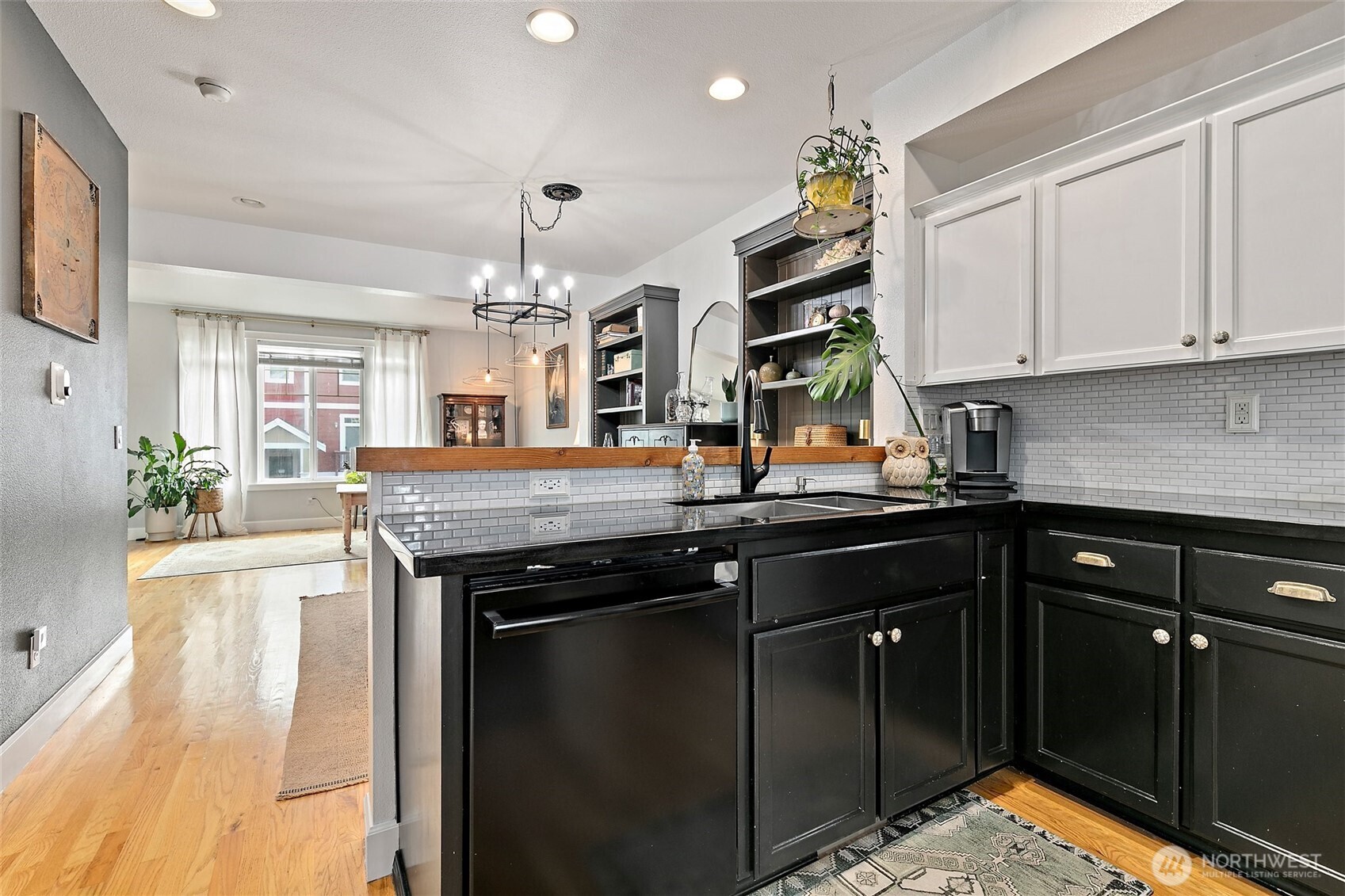 137 Maple Street Tacoma, WA 98466 - Photo 12 of 39 a kitchen with stainless steel appliances kitchen island granite countertop a sink a stove and cabinets