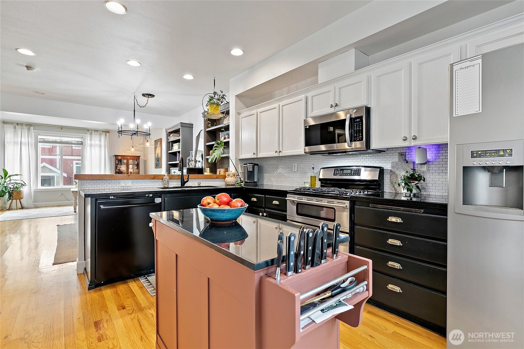 137 Maple Street Tacoma, WA 98466 - Photo 13 of 39 a kitchen with kitchen island granite countertop a sink cabinets and stainless steel appliances