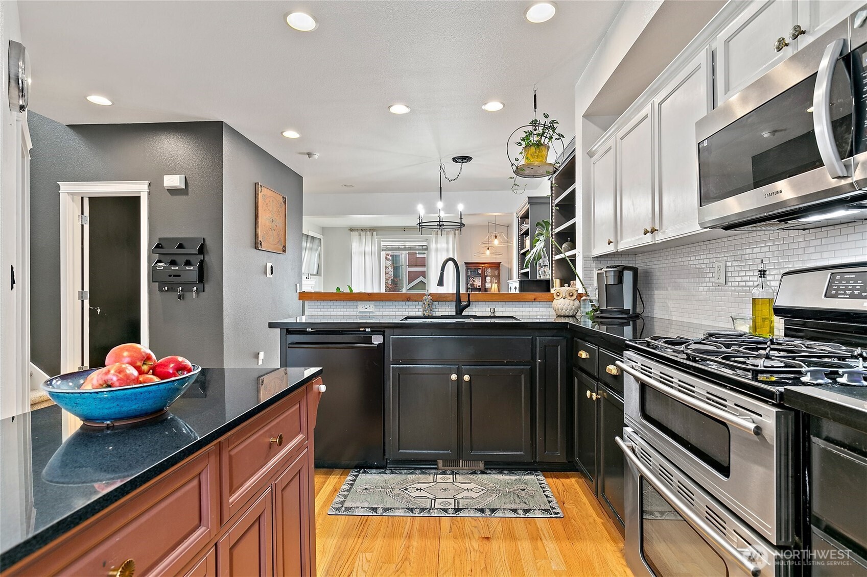 137 Maple Street Tacoma, WA 98466 - Photo 14 of 39 a kitchen with stainless steel appliances granite countertop a stove sink and cabinets
