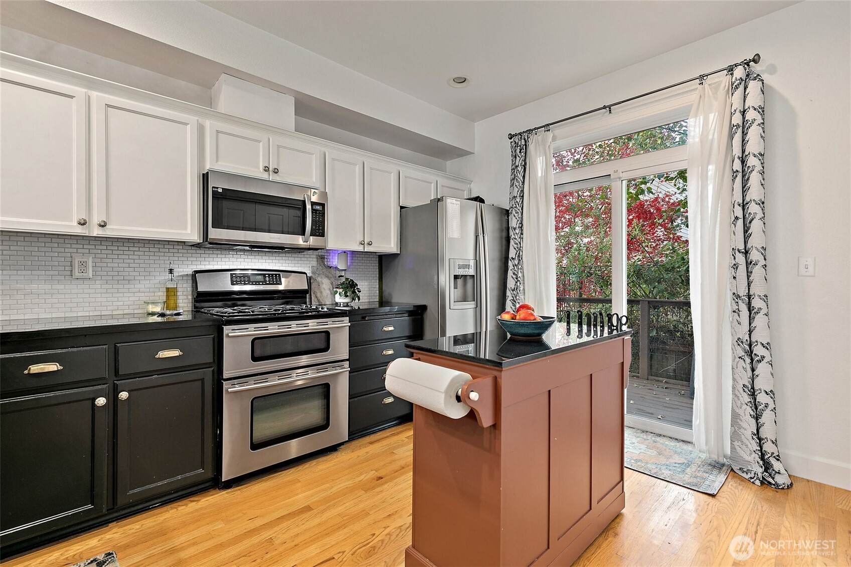 137 Maple Street Tacoma, WA 98466 - Photo 15 of 39 a kitchen with stainless steel appliances granite countertop a refrigerator stove and sink