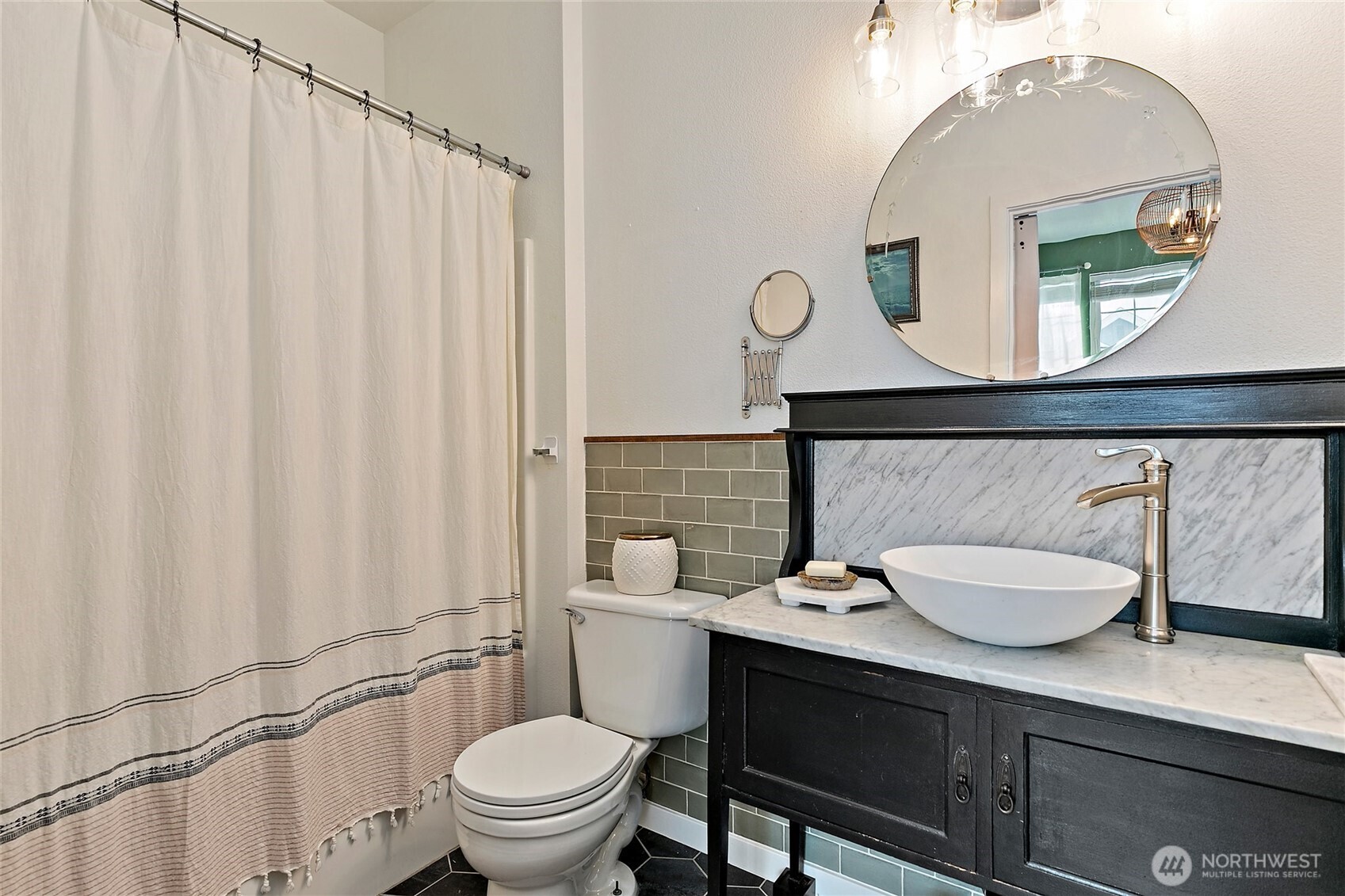 137 Maple Street Tacoma, WA 98466 - Photo 26 of 39 a bathroom with a toilet a sink and mirror