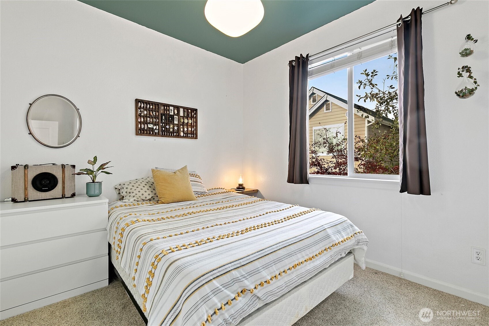 137 Maple Street Tacoma, WA 98466 - Photo 29 of 39 a bedroom with a large bed and a window