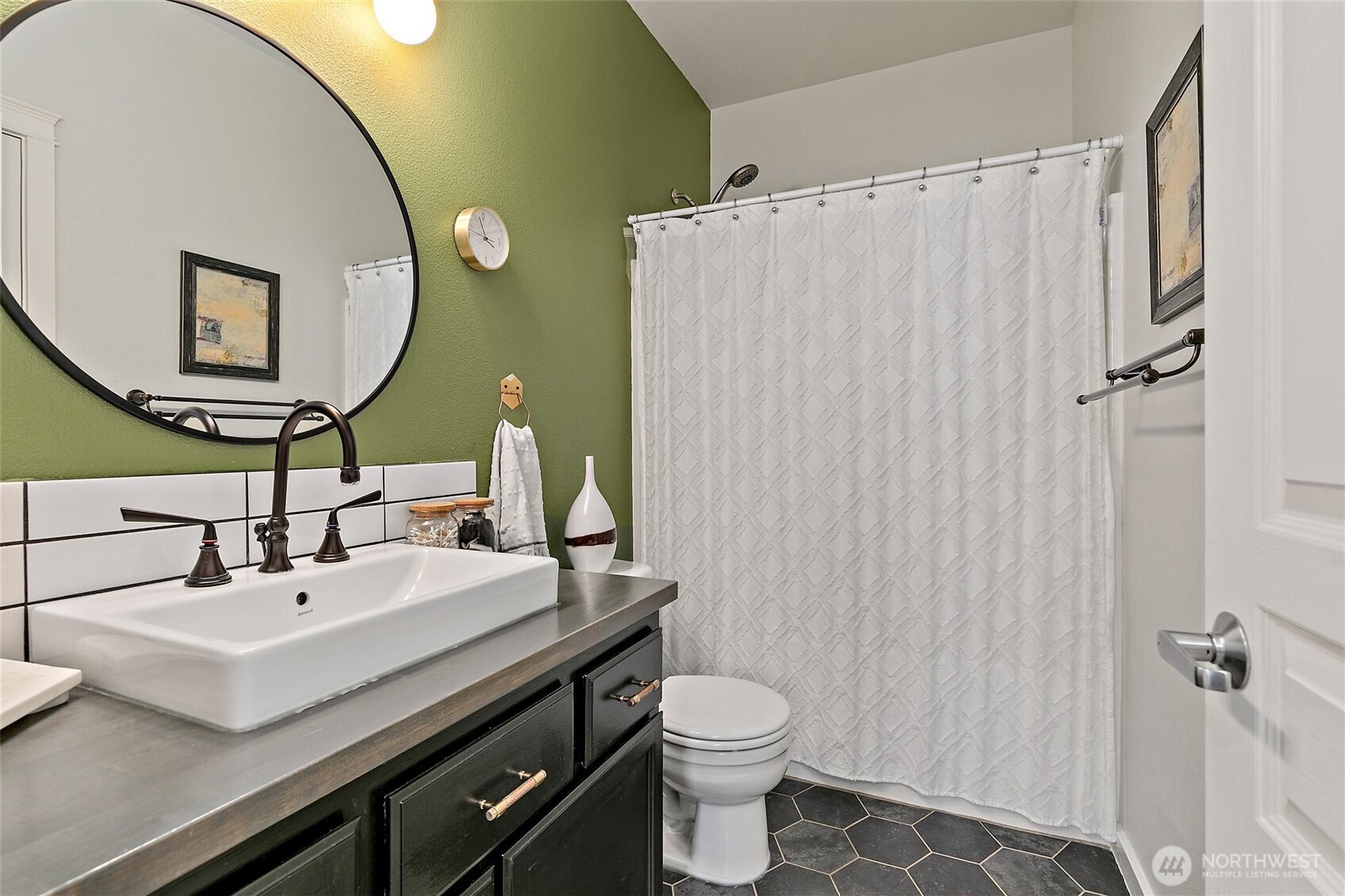 137 Maple Street Tacoma, WA 98466 - Photo 30 of 39 a bathroom with a sink and a mirror