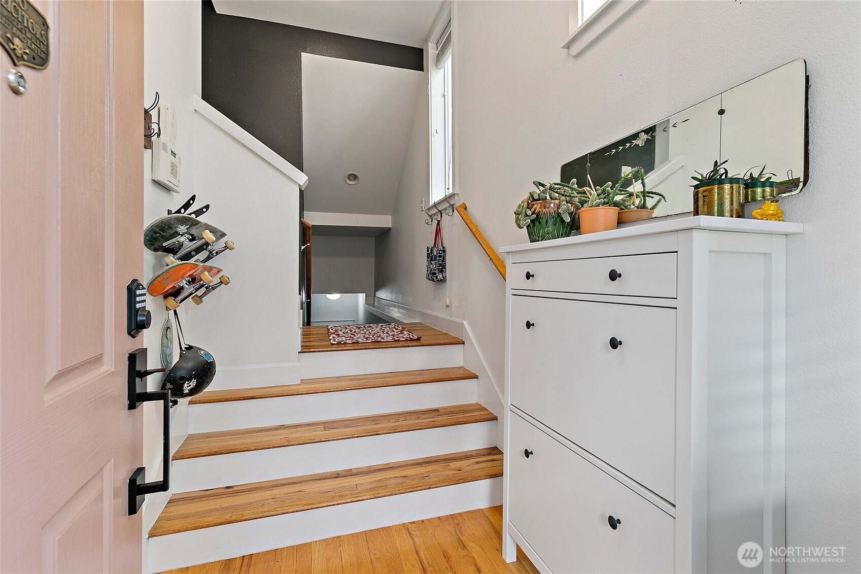 137 Maple Street Tacoma, WA 98466 - Photo 3 of 39 a view of a hallway to room with wooden floor and stairs